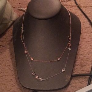 Two long necklaces one rose gold and silver